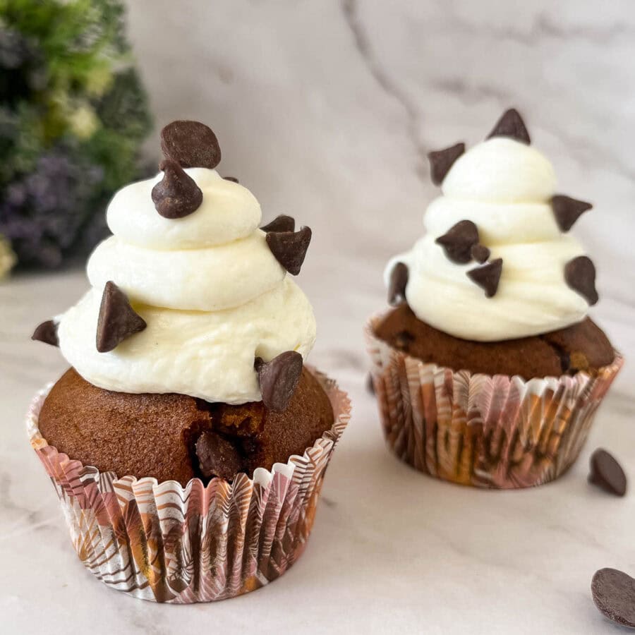 Pumpkin cupcakes with cream cheese frosting.