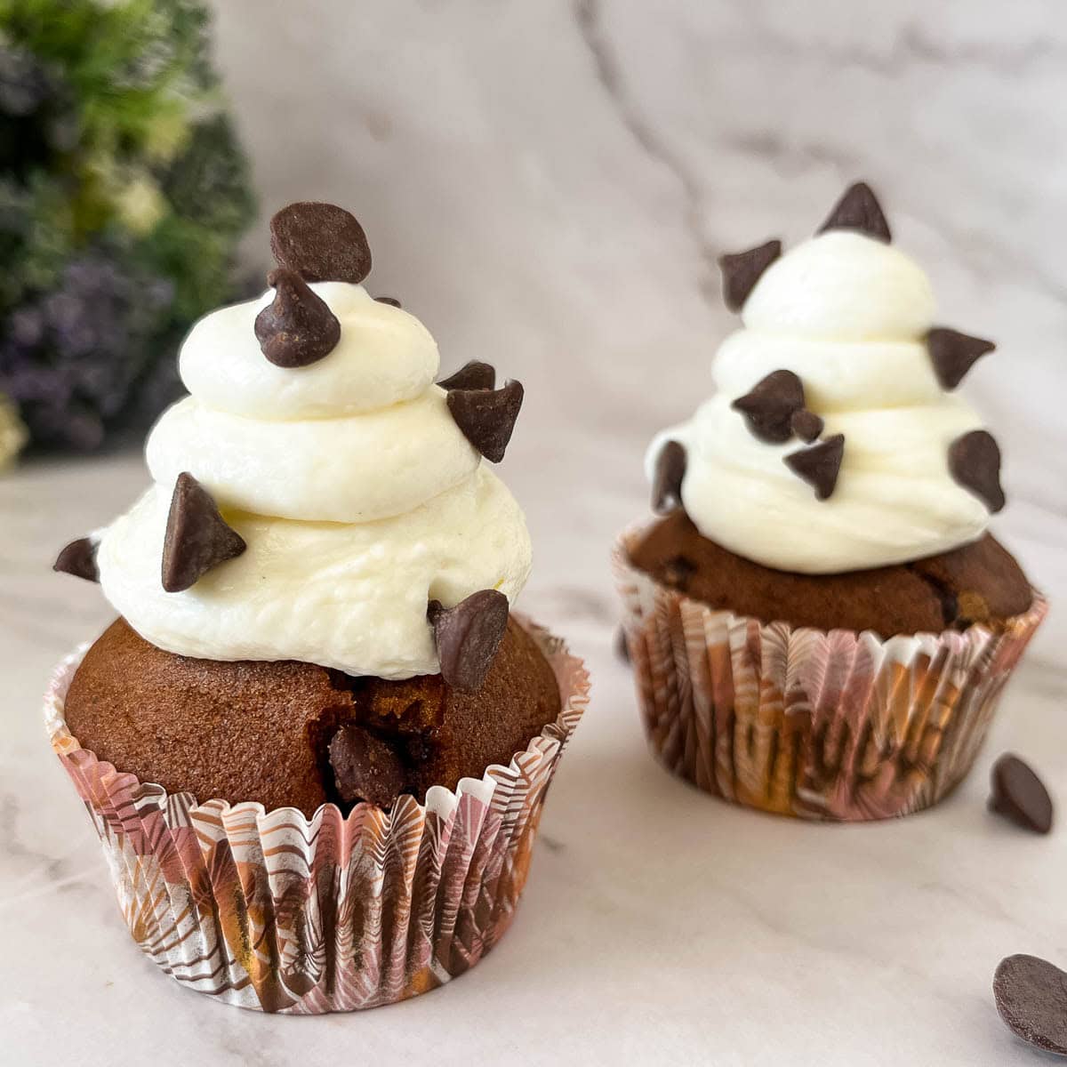 Pumpkin cupcakes with cream cheese frosting.