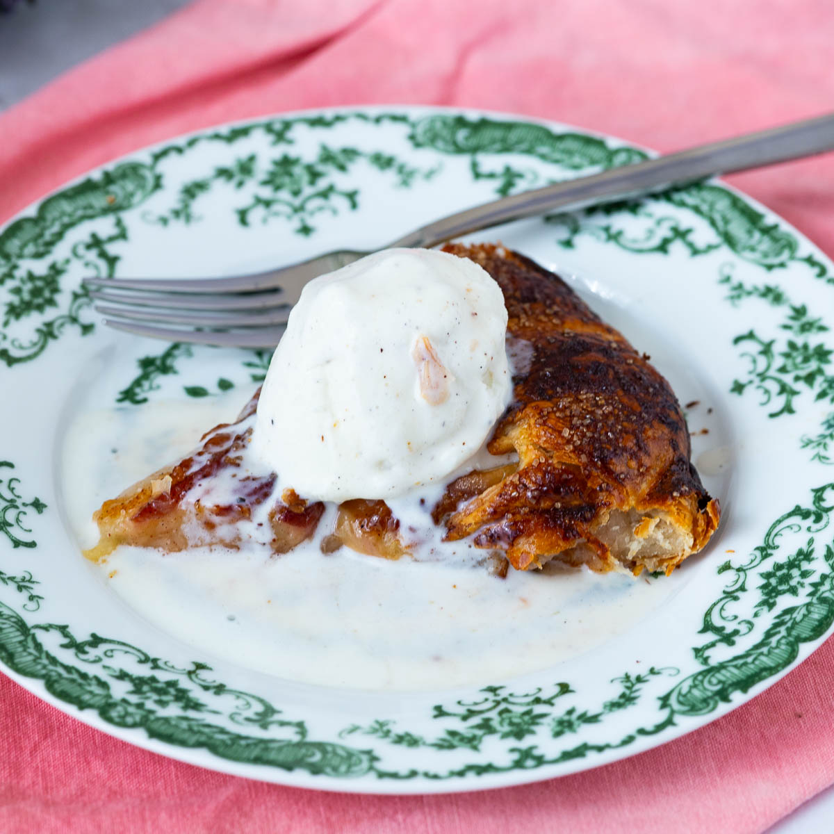A slice of peach galette on the table.