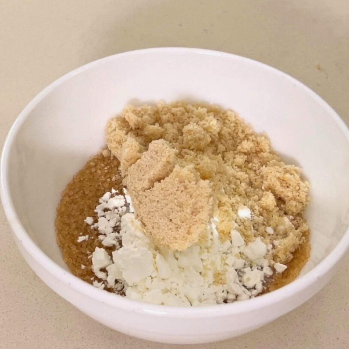 A bowl with cinnamon sugar and starch mixture.