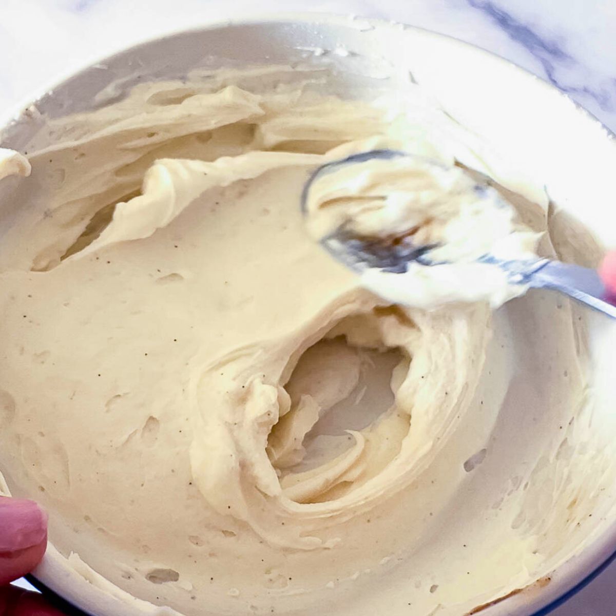 Cream cheese for baking in a bowl.