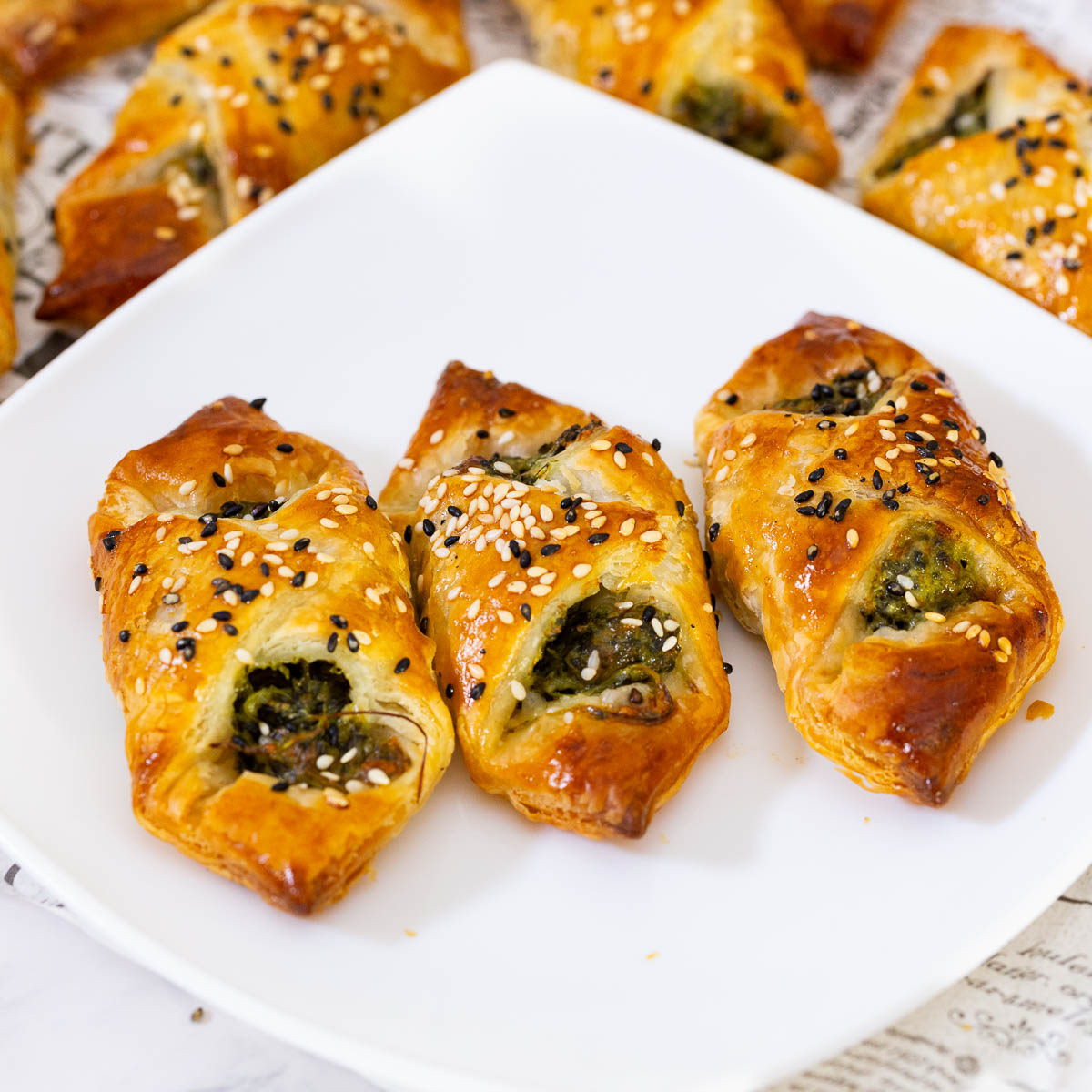 A plate with spinach appetizers.