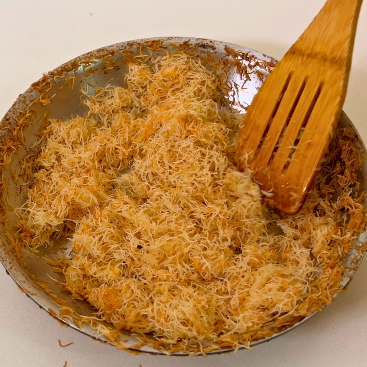 Frying pan with toasted kataif.