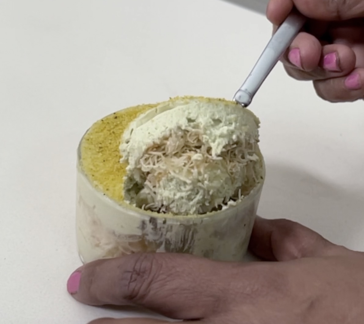 Trifle cups with pistachios on display.