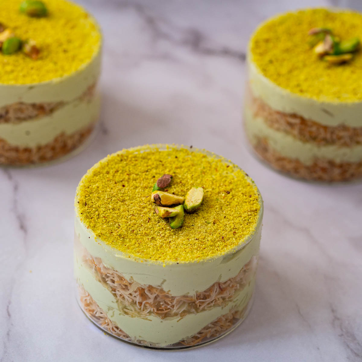 Trifle cups with pistacho on display.