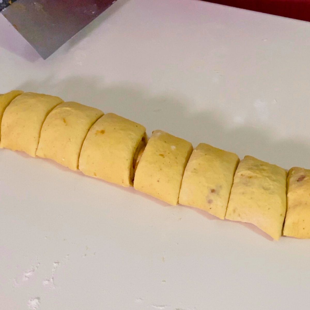 Pumpkin dough rolled with cinnamon butter, cut into slices.
