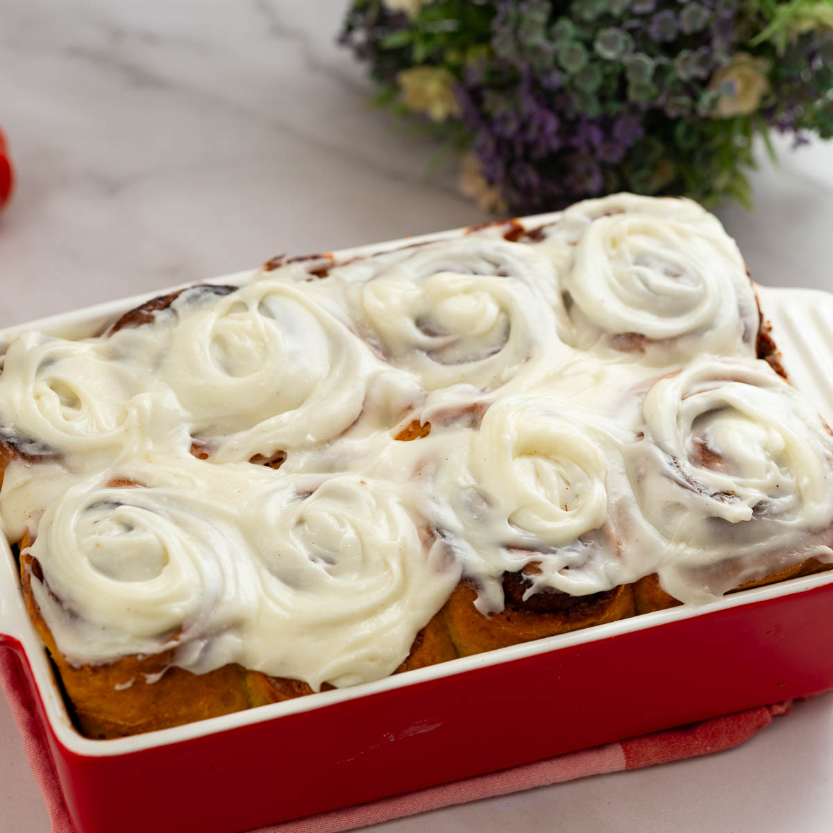 Baking dish with baking cinnamon rolls.