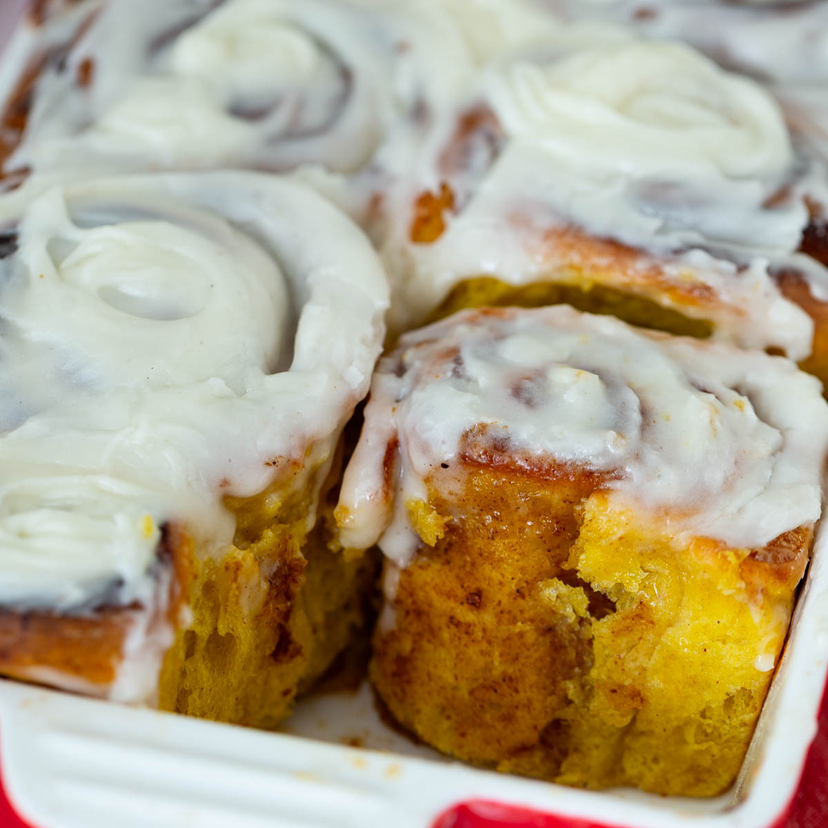 Frosted Pumpkin cinnamon rolls with cream cheese.