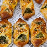 Pinterest image for spinach and cheese puff pastry turnovers.