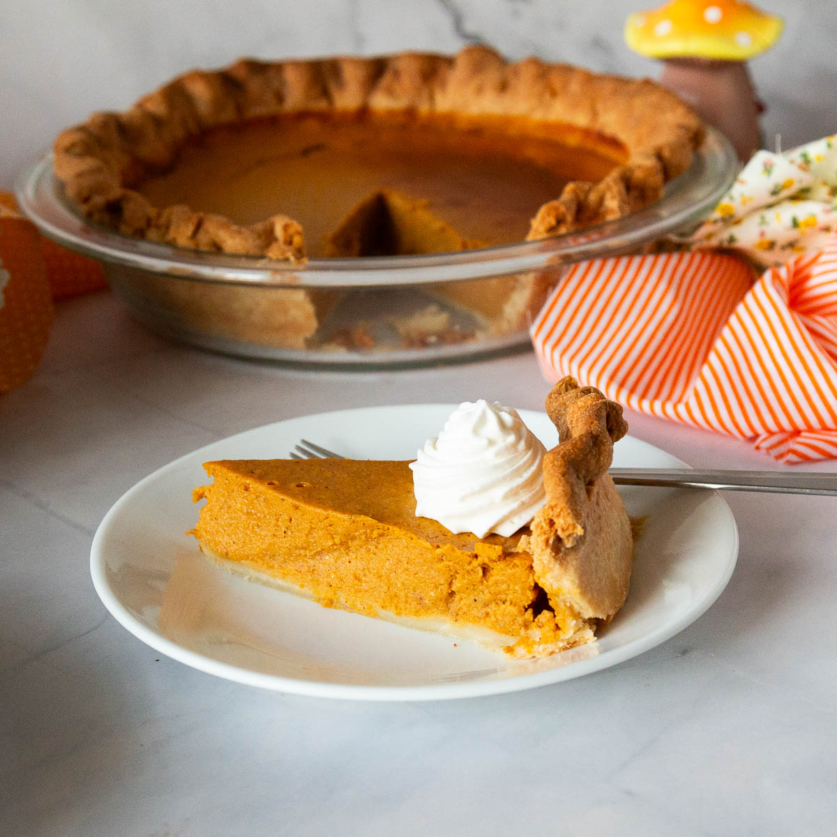 A fresh pumpkin pie with maple syrup.