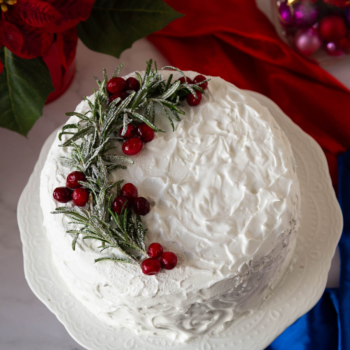 A Christmas cake on the cake stand.