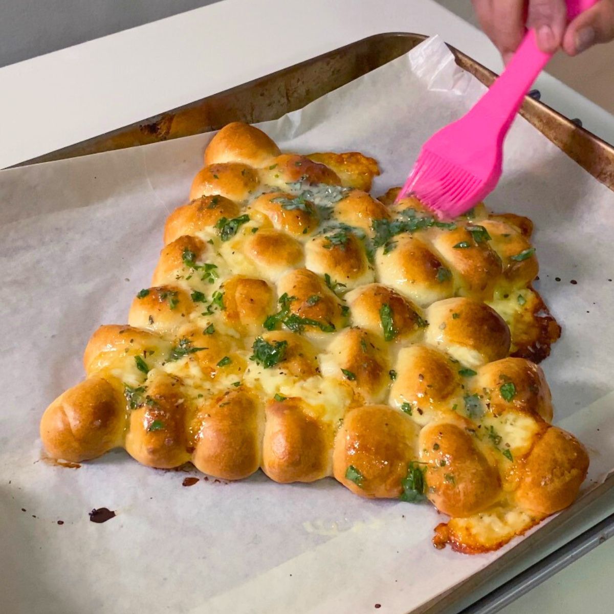 Brush the Christmas Tree with garlic butter and herbs.