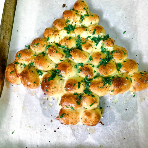 Christmas Tree garlic butter bread on a baking tray.