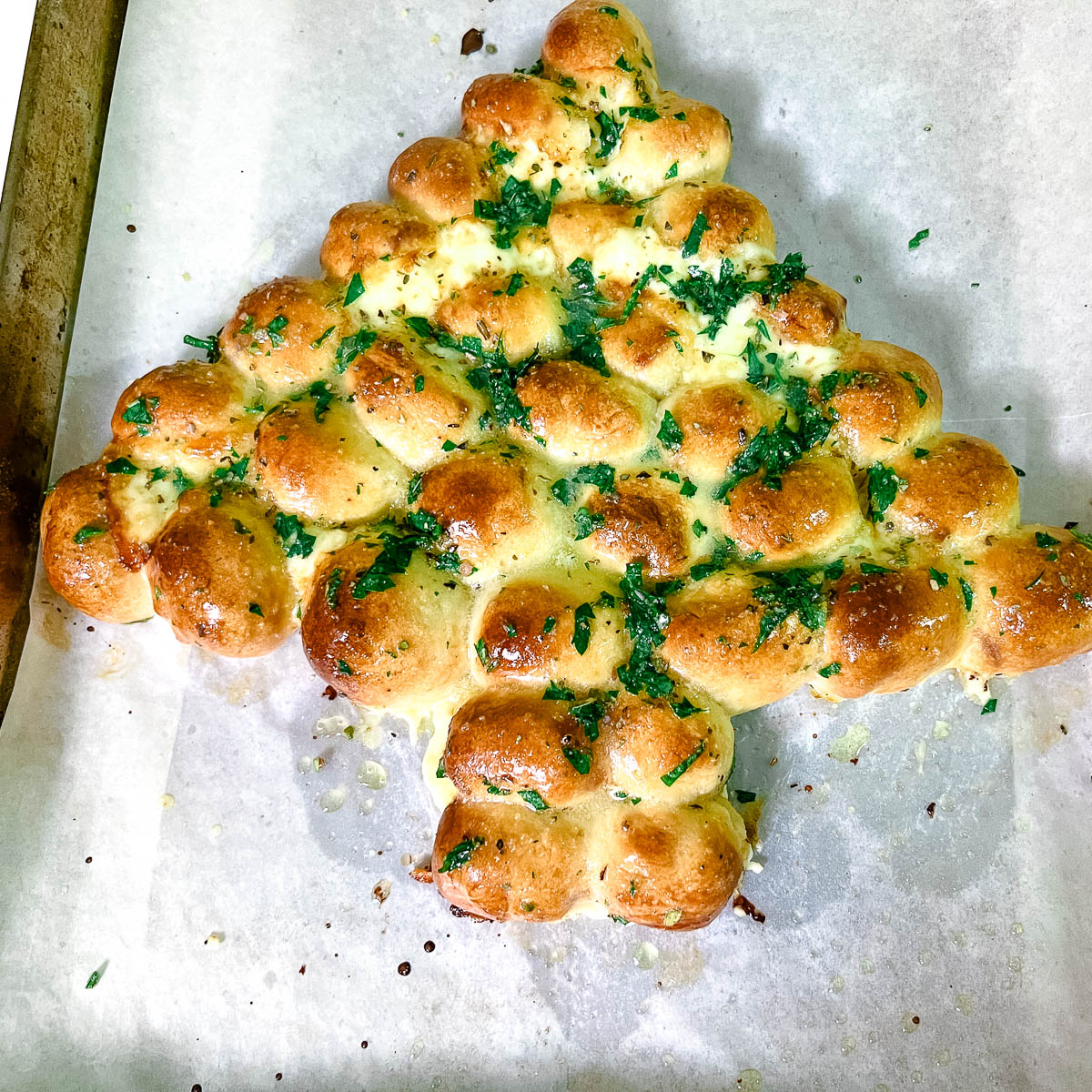 Christmas Tree garlic butter bread on a baking tray.