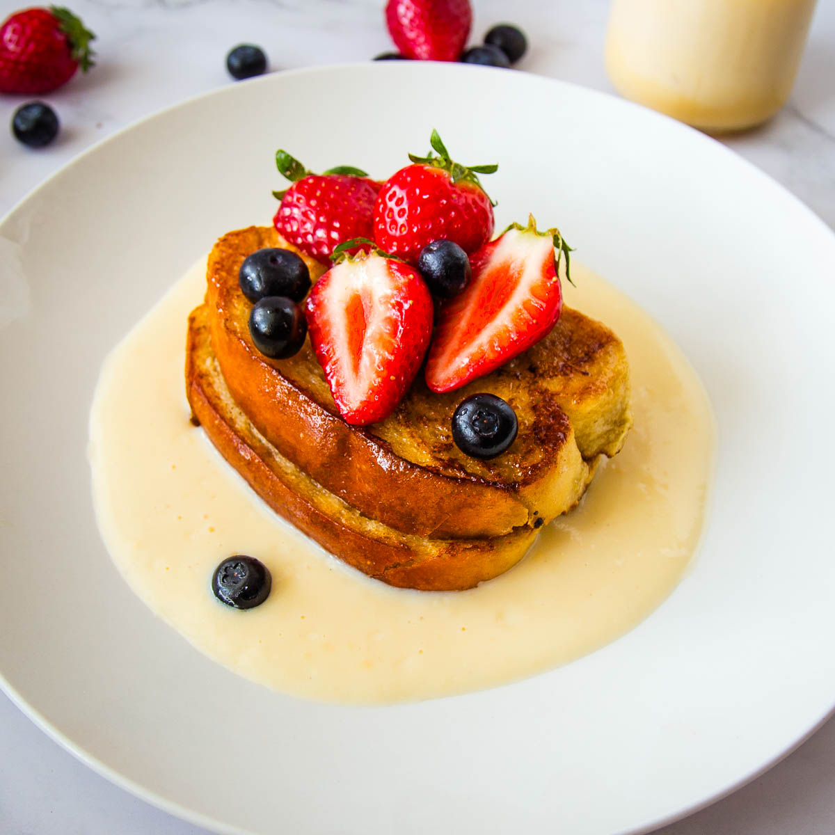 French toast with crème anglaise served with fresh berries, a special-occasion breakfast or dessert perfect for Valentine’s Day or Mother’s Day.