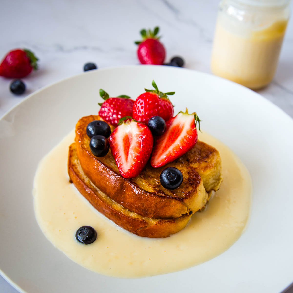 French toast with crème anglaise served with fresh berries, a special-occasion breakfast or dessert perfect for Valentine’s Day or Mother’s Day.