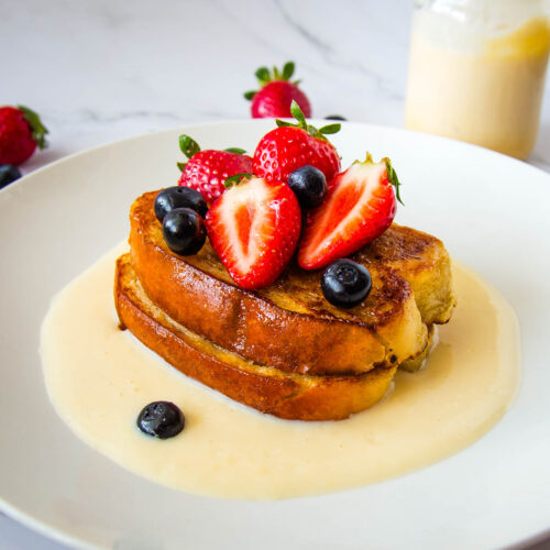 French toast with crème anglaise served with fresh berries, a special-occasion breakfast or dessert perfect for Valentine’s Day or Mother’s Day.