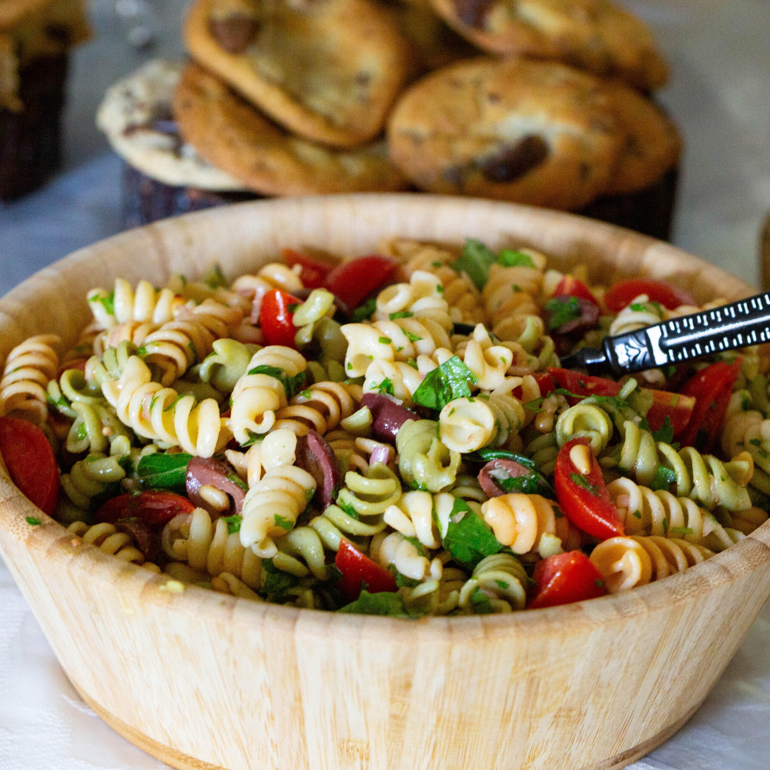 A salad bowl with pasta salad.