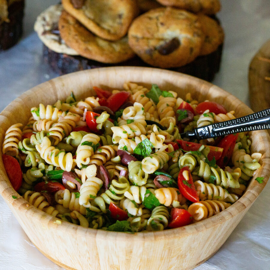 A wooden bowl with pasta with lemon juice.