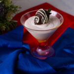A martini dessert cup with mousse.