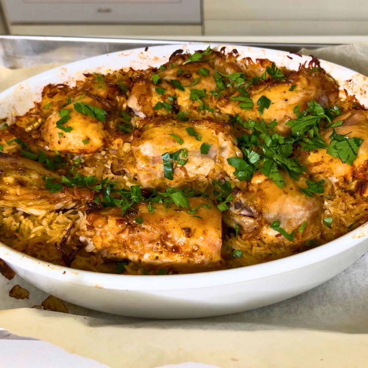 A baking dish with chicken and rice.