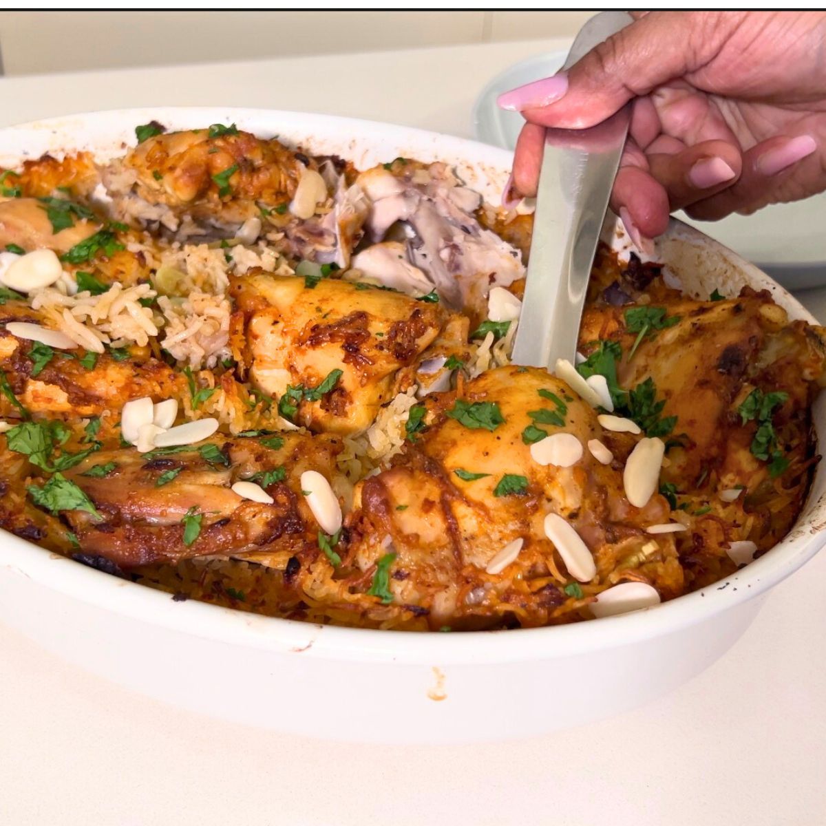A baking dish with chicken and rice.