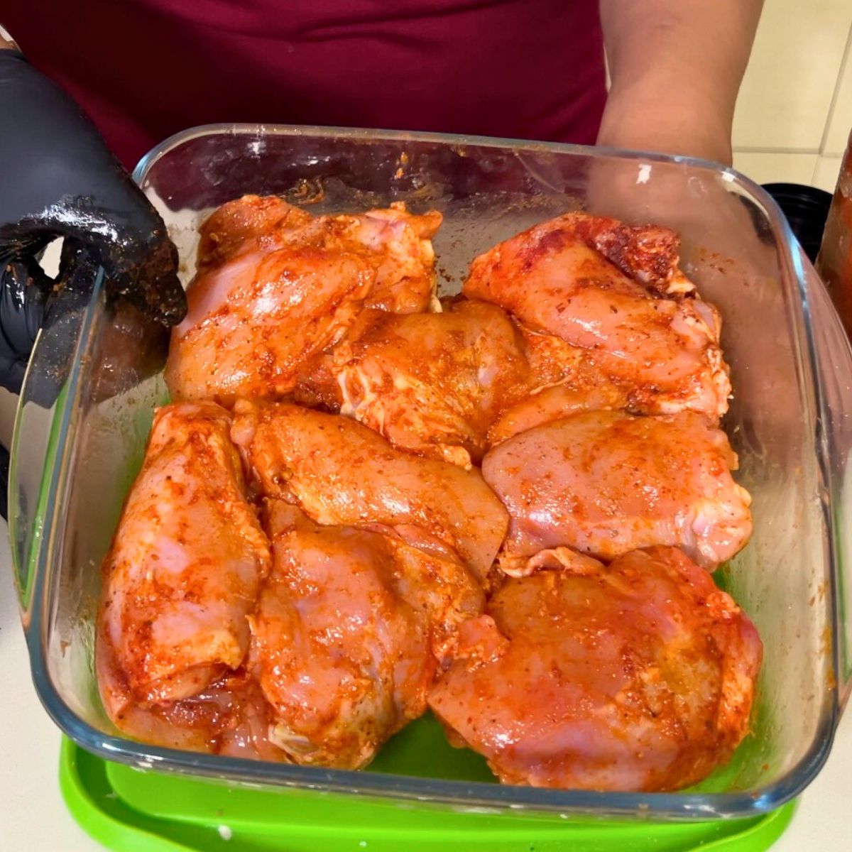Chicken marination in a glass dish.
