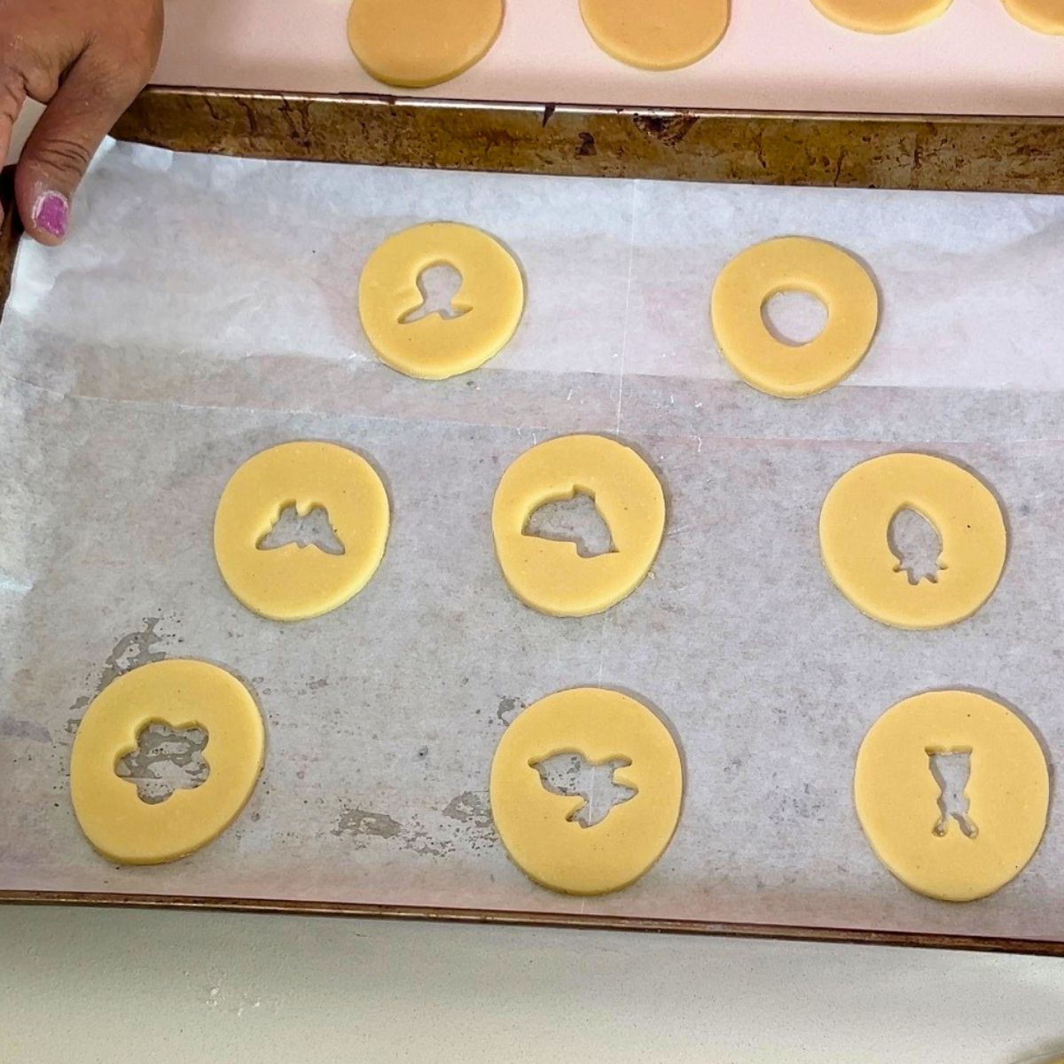 Sugar cookies with Easter cut-out centers for baking.