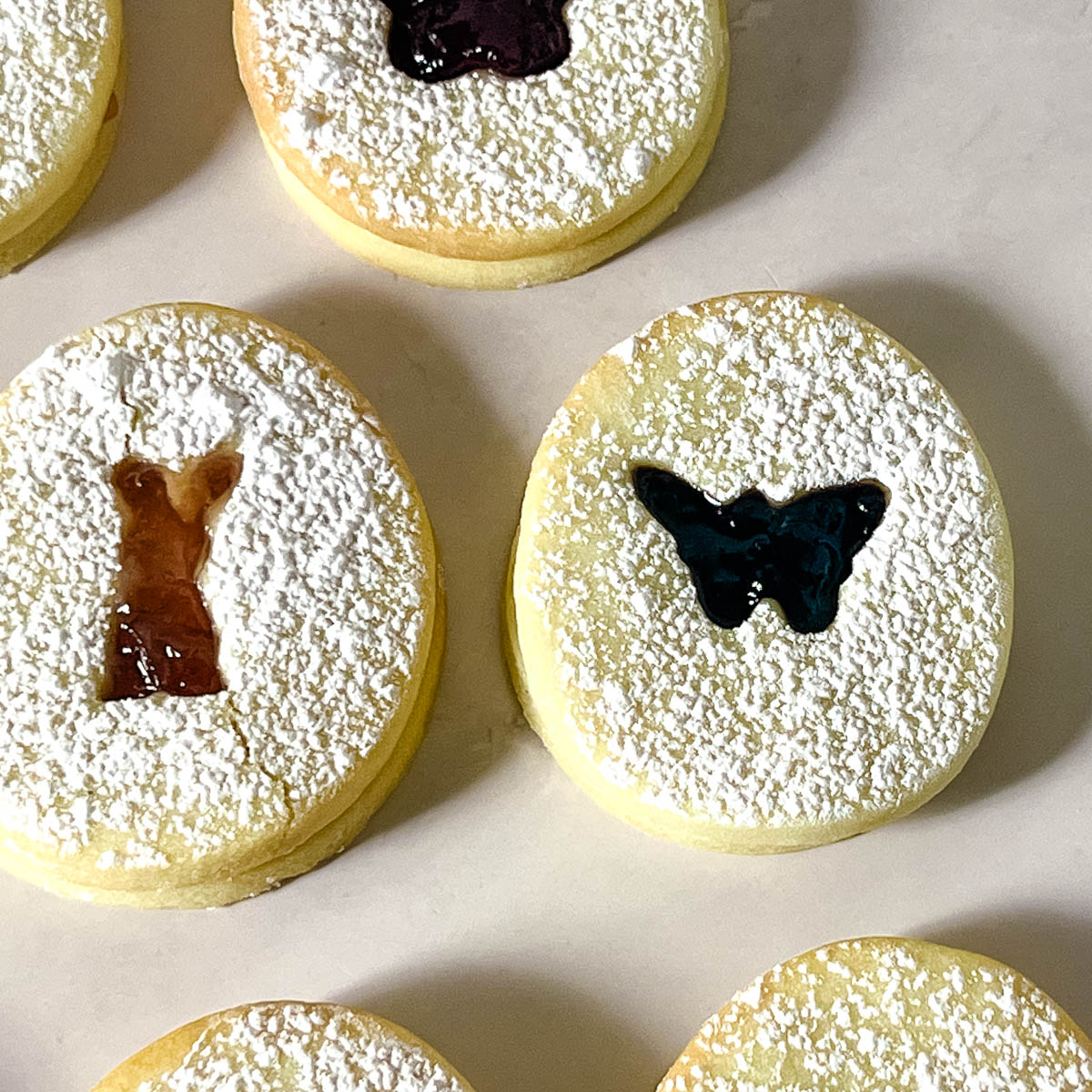 Butterfly cut out sandwich cookie on the table.