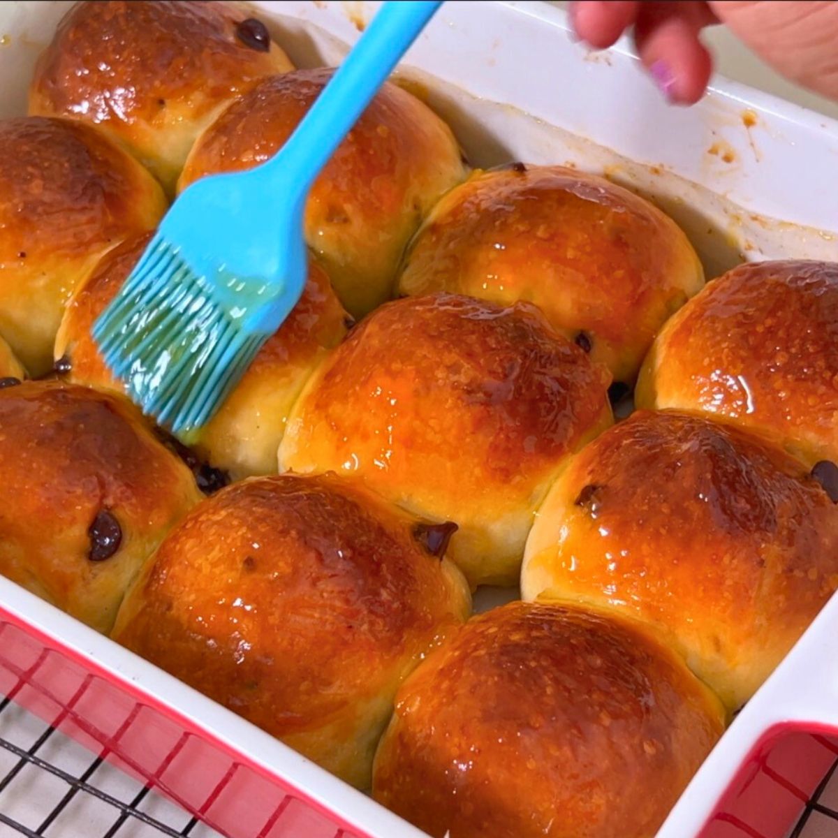 Brush Hot cross buns with Apricot Jam.