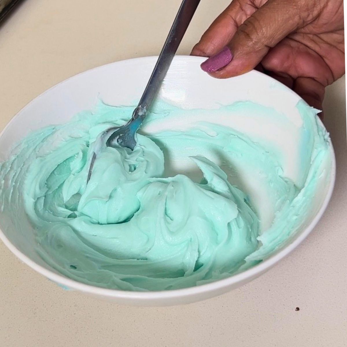 A bowl with buttercream frosting.