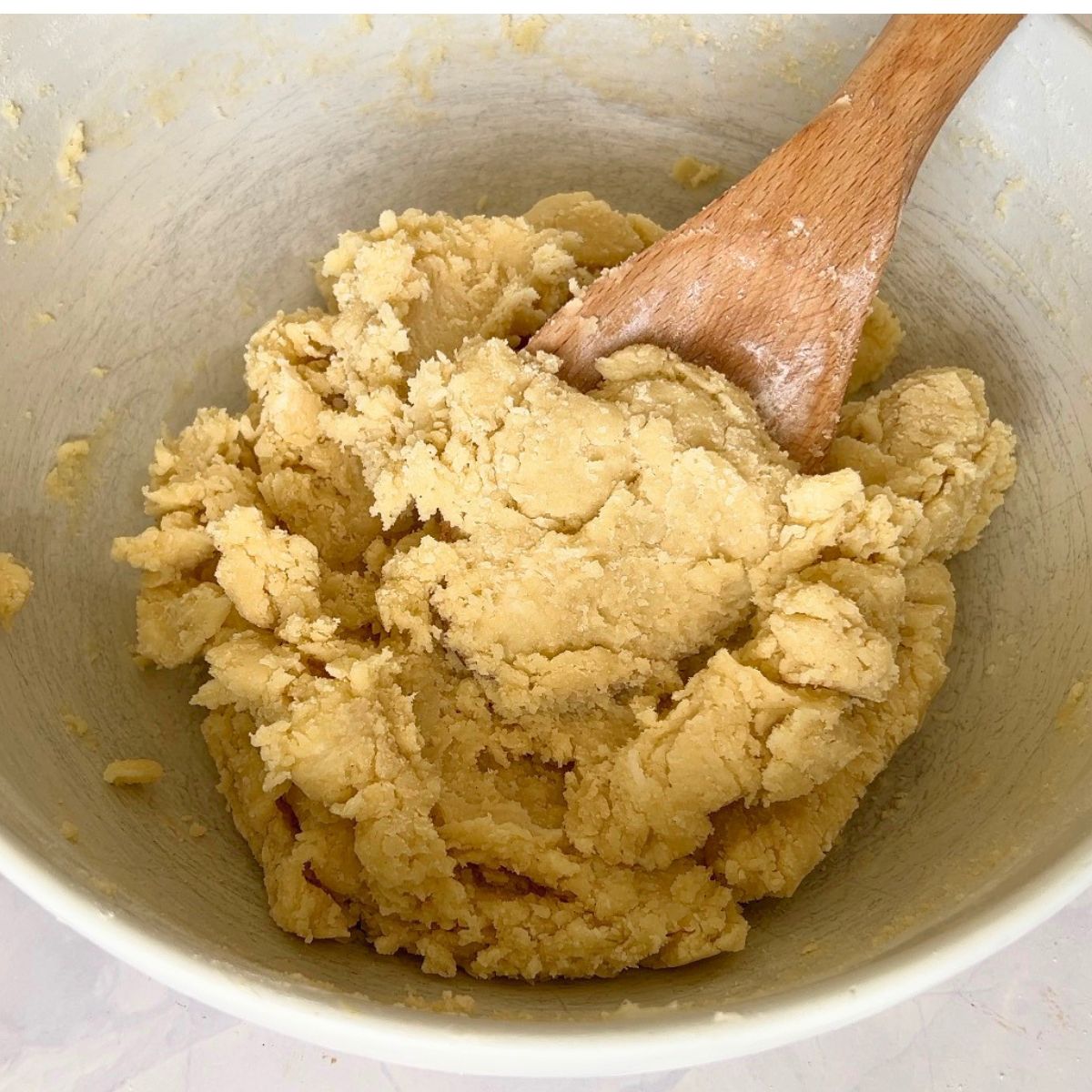 A bowl with sugar cookie dough.