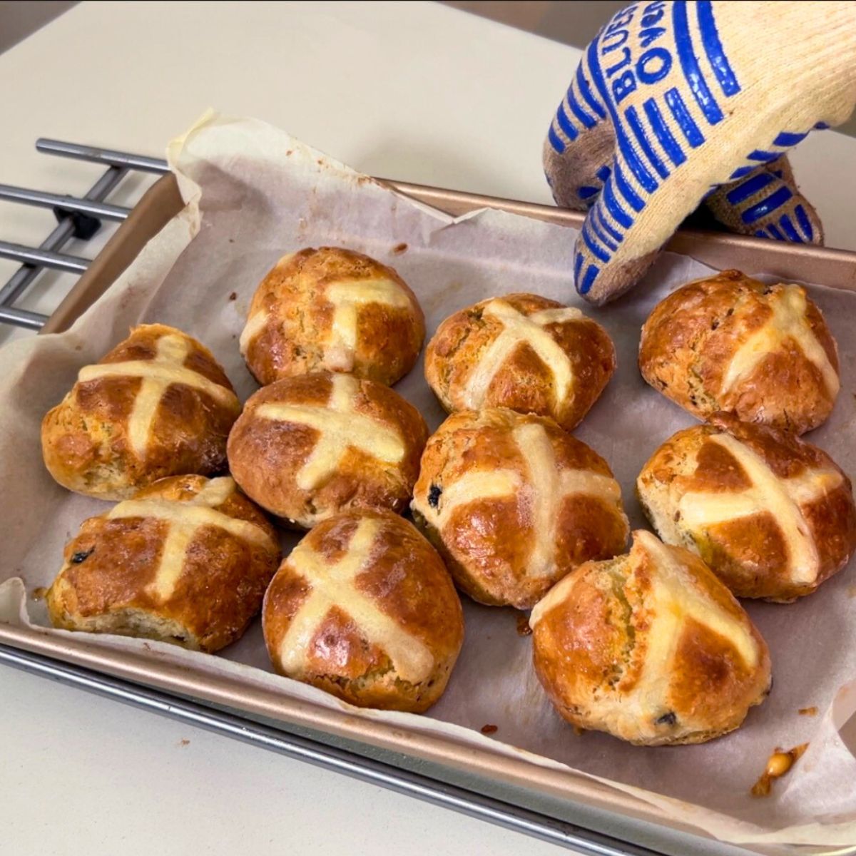 Fresh hot cross buns on the platter.