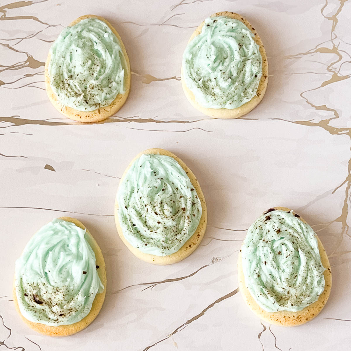 Speckled eggs with buttercream frosting.