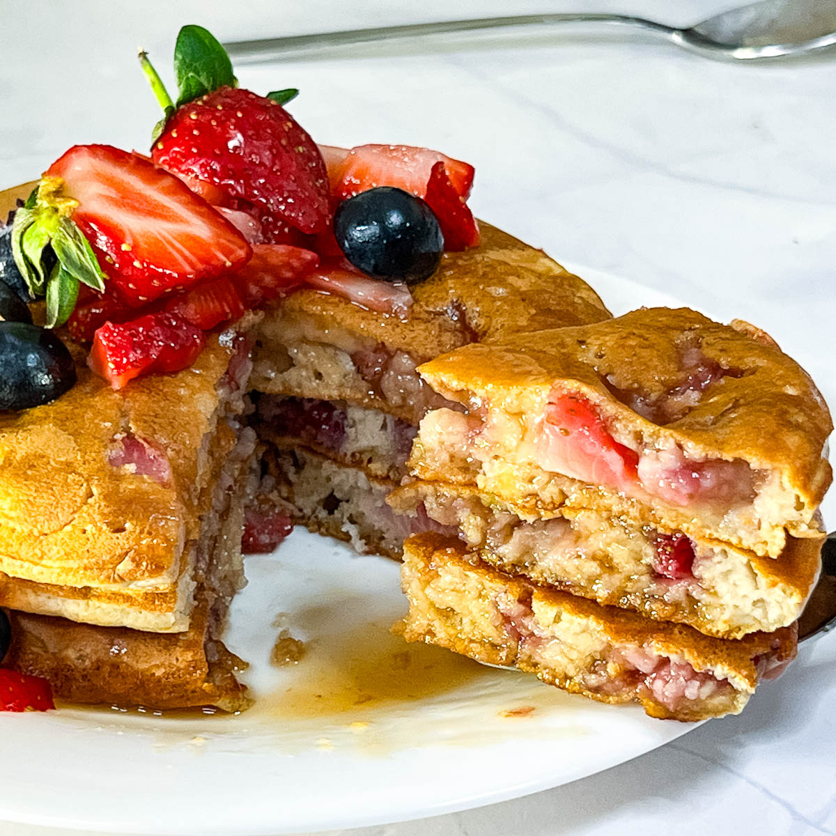 Strawberry pancakes cut into slices.