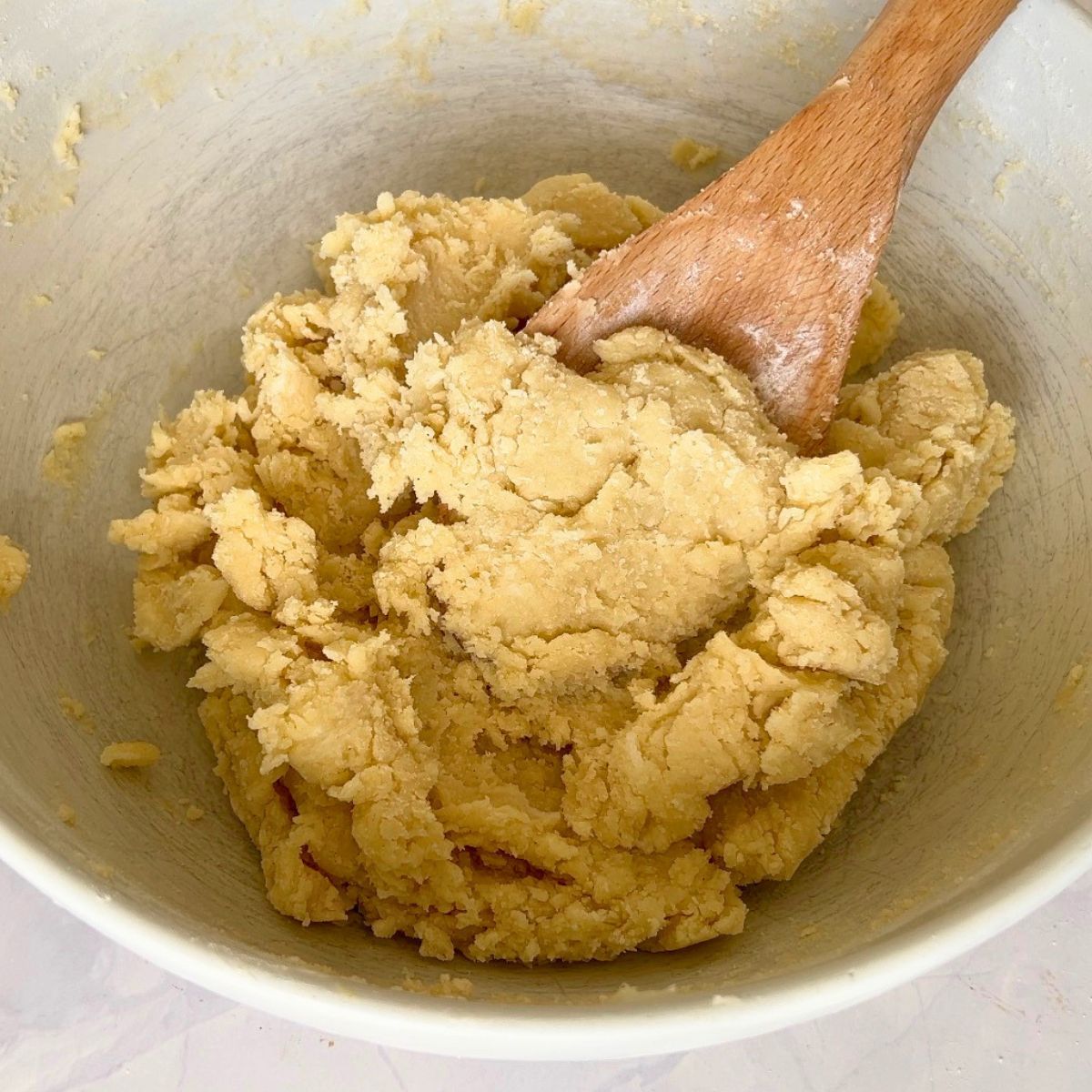 A bowl with sugar cookie dough.