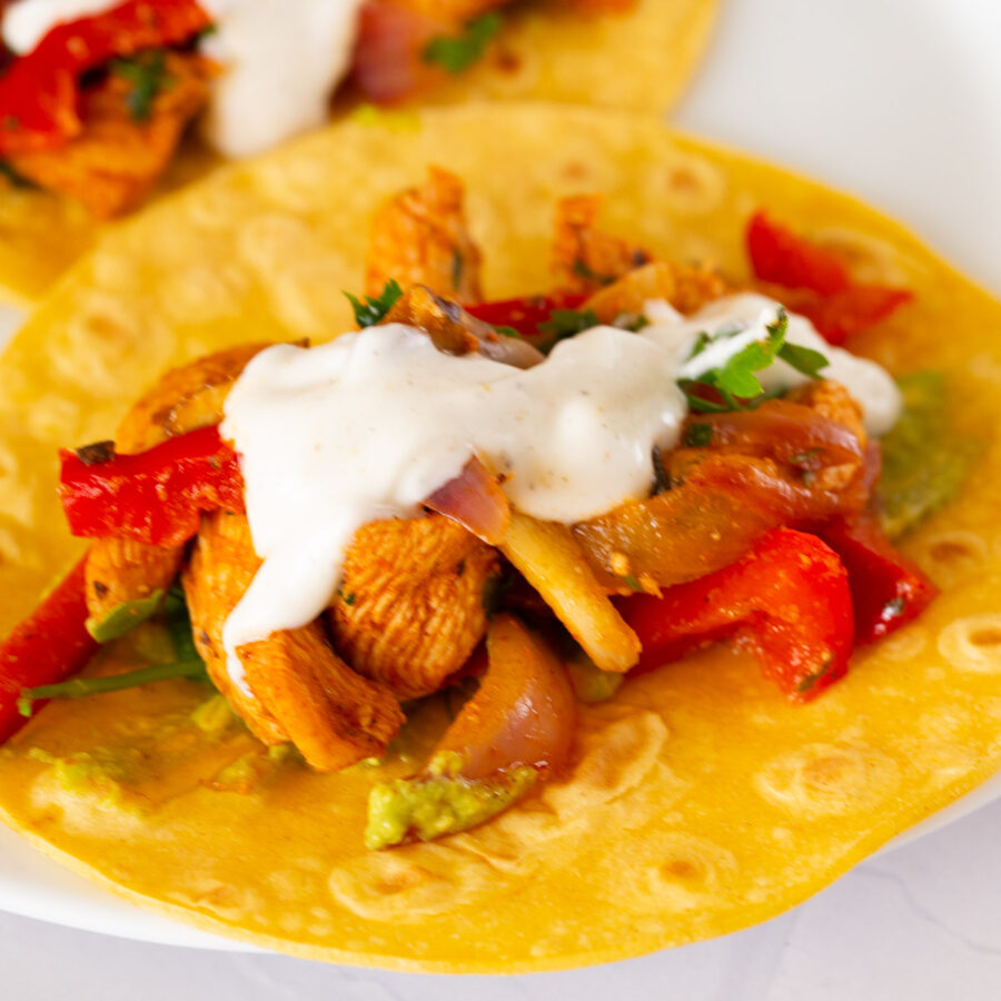 A taco with chicken and veggies.