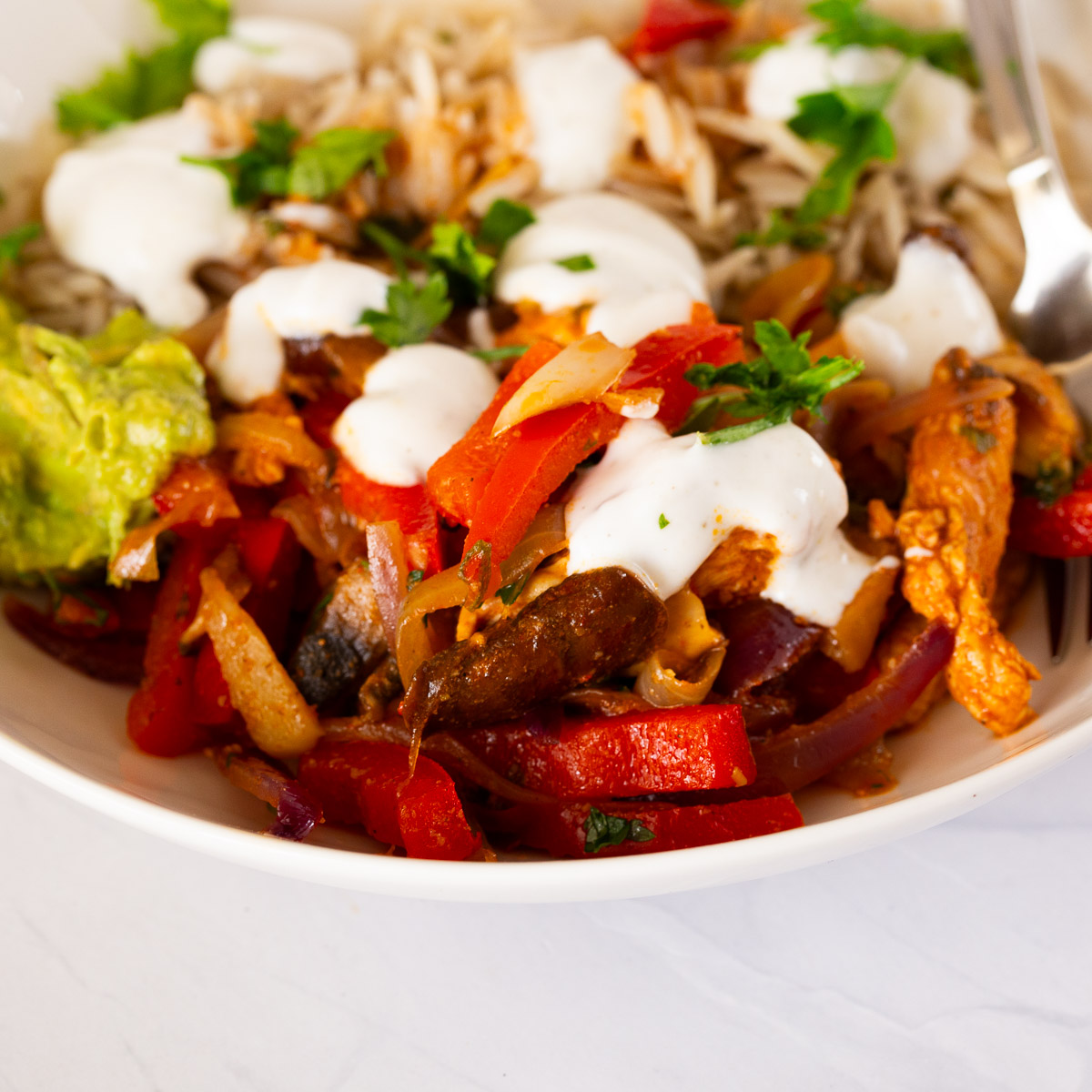 A chicken taco bowl with rice and salad.