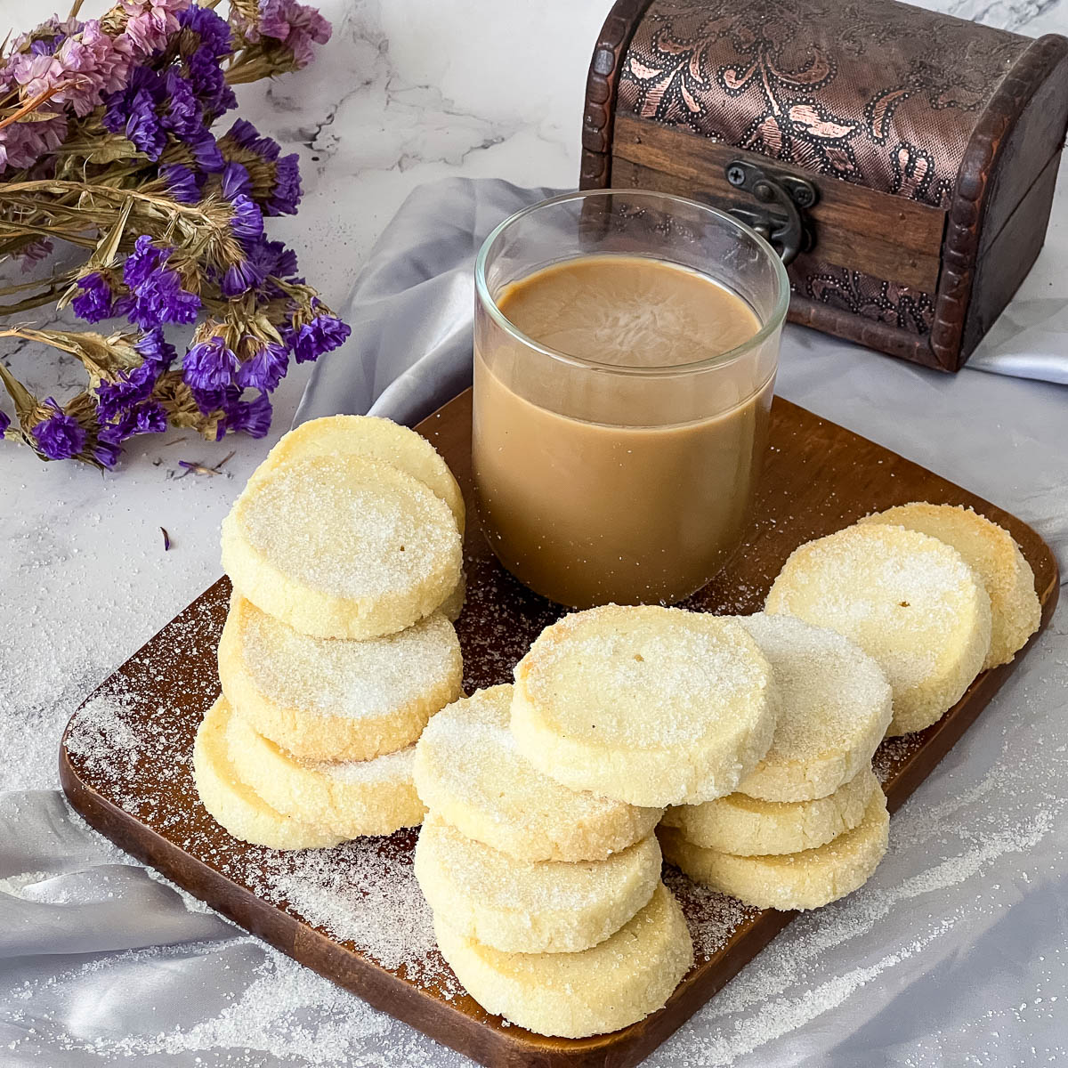 Butter cookies on a wooden board.