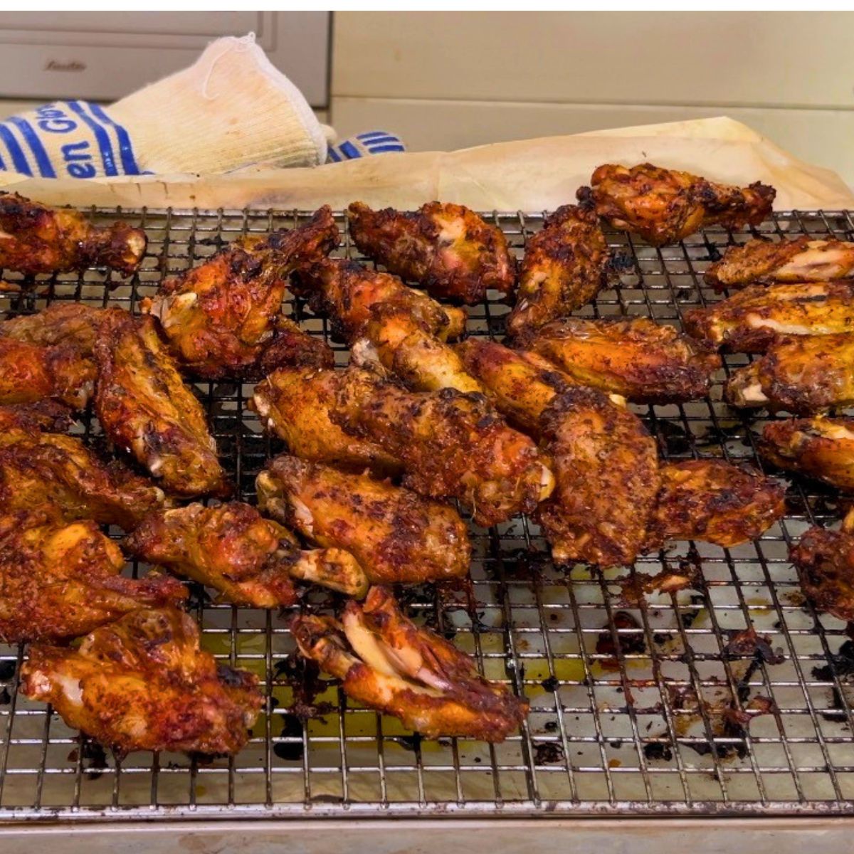Chicken wings out of the oven on wire rack.