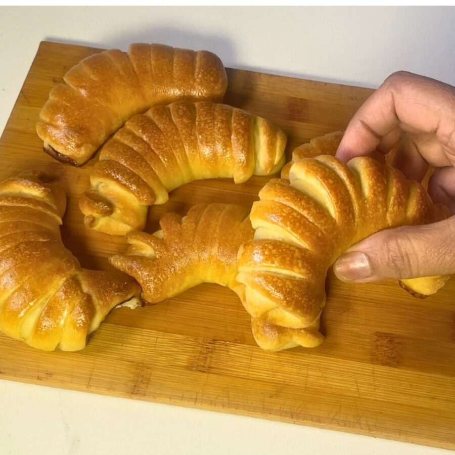 A crescent roll on the table.