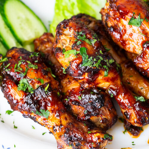 BBQ Legs in air fryer over lettuce.