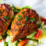 Scored and spiced chicken breast.