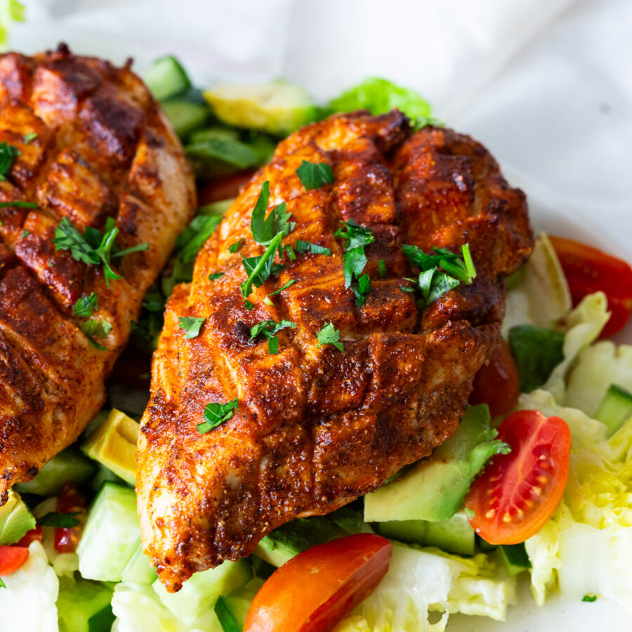 Scored and spiced chicken breast.