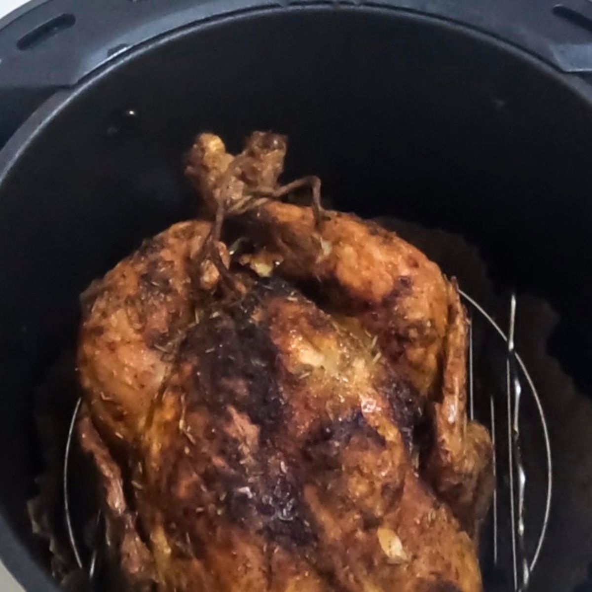 Air fryer with roast chicken.