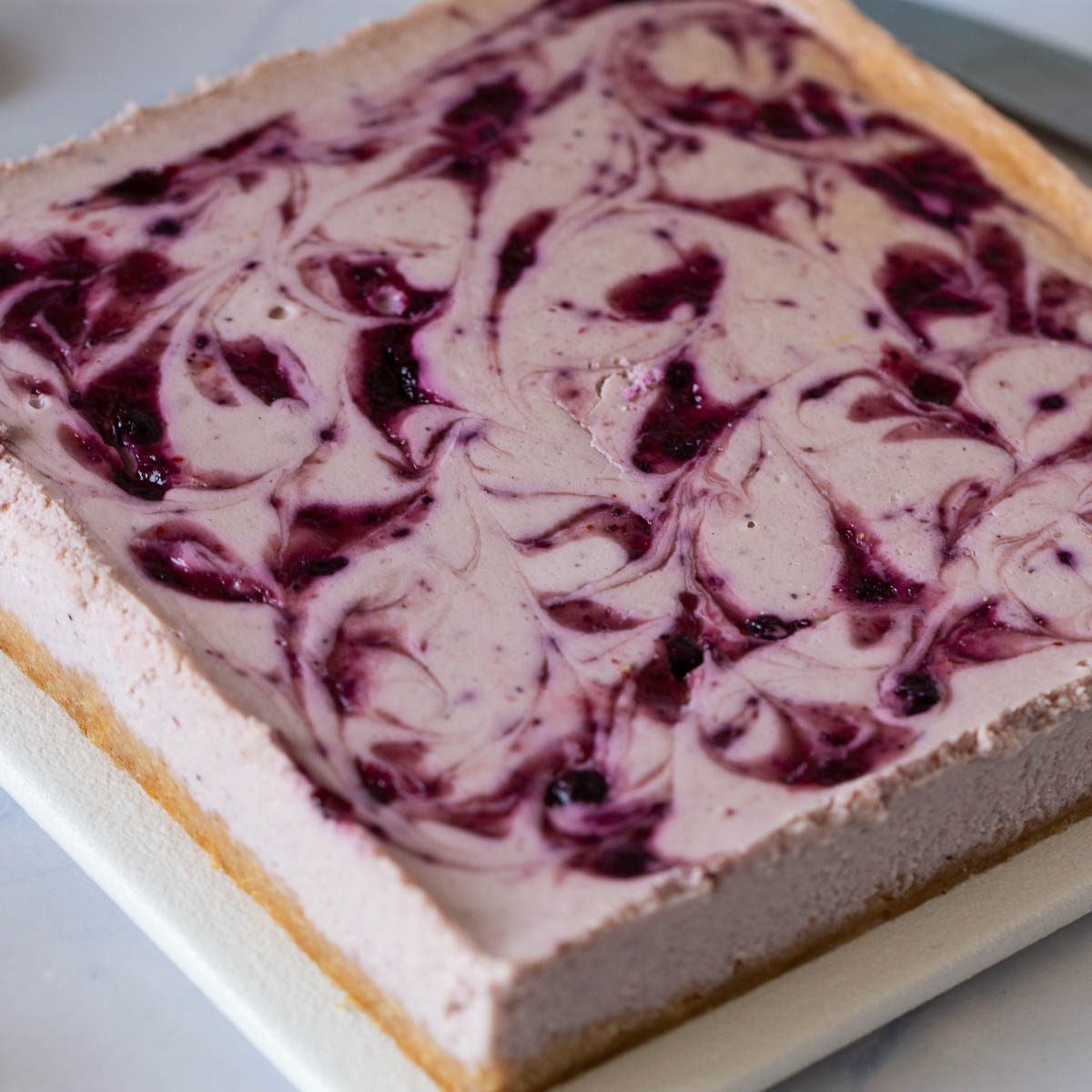 Pinterest image for Blueberry Swirl Cheesecake bars.