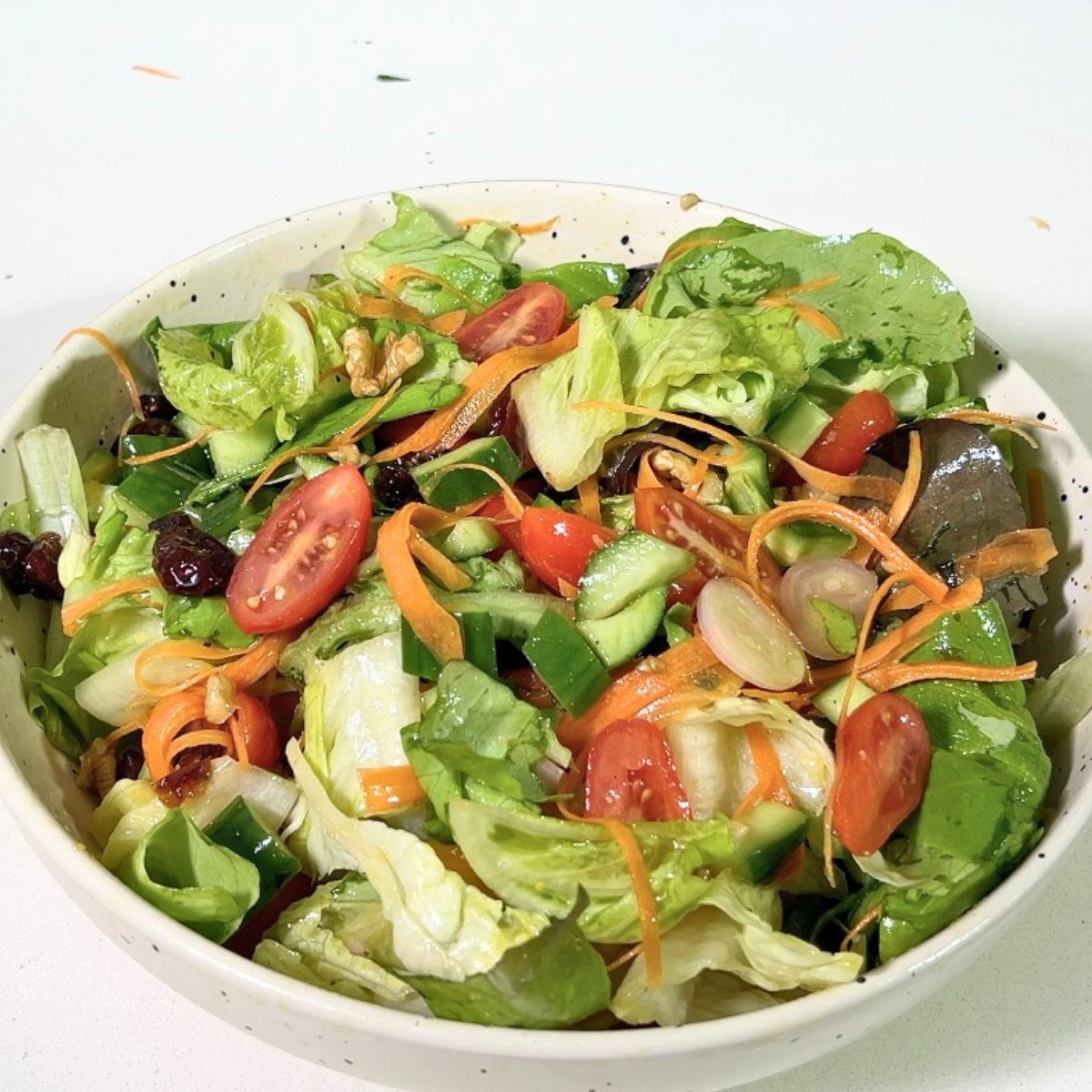 A bowl with butter lettuce salad.