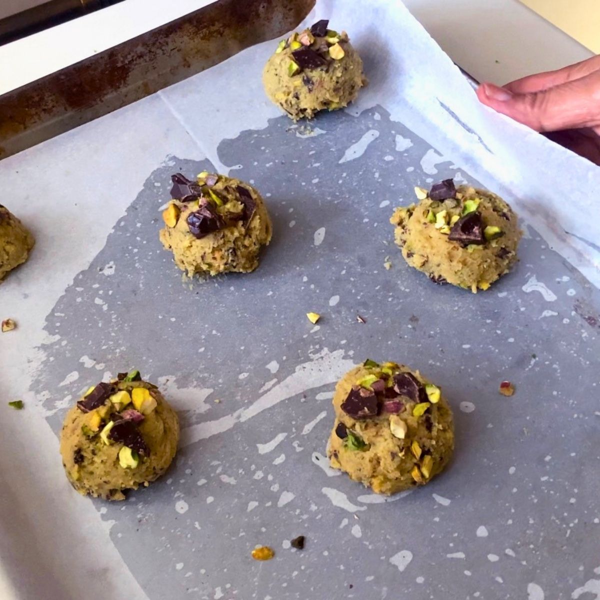 Cookie dough balls on the tray for baking.