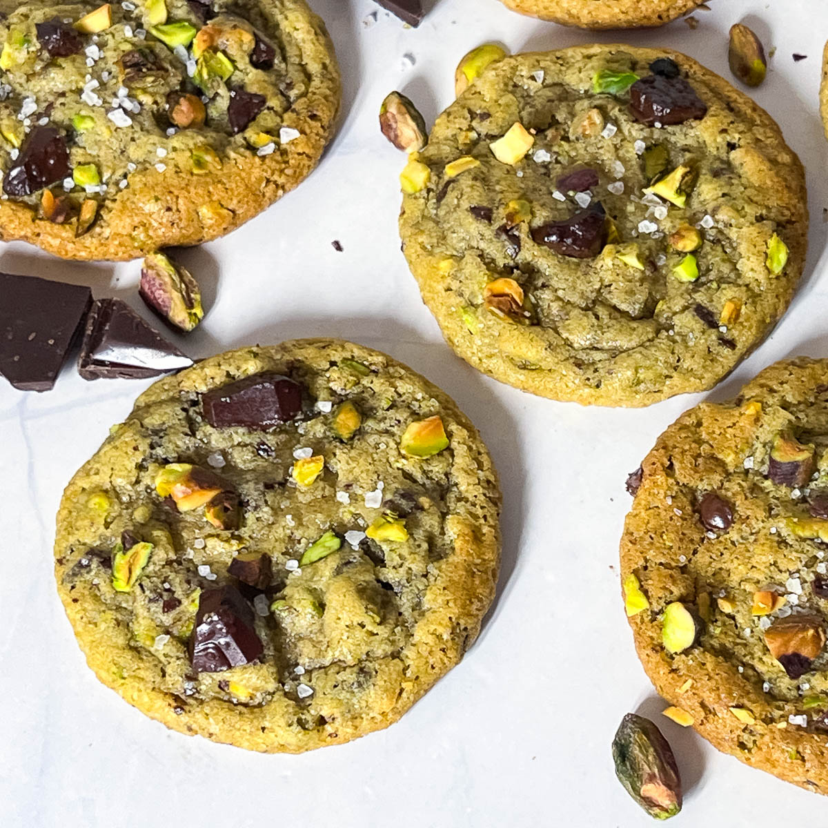 A table with chocolate chip pistachio cookies