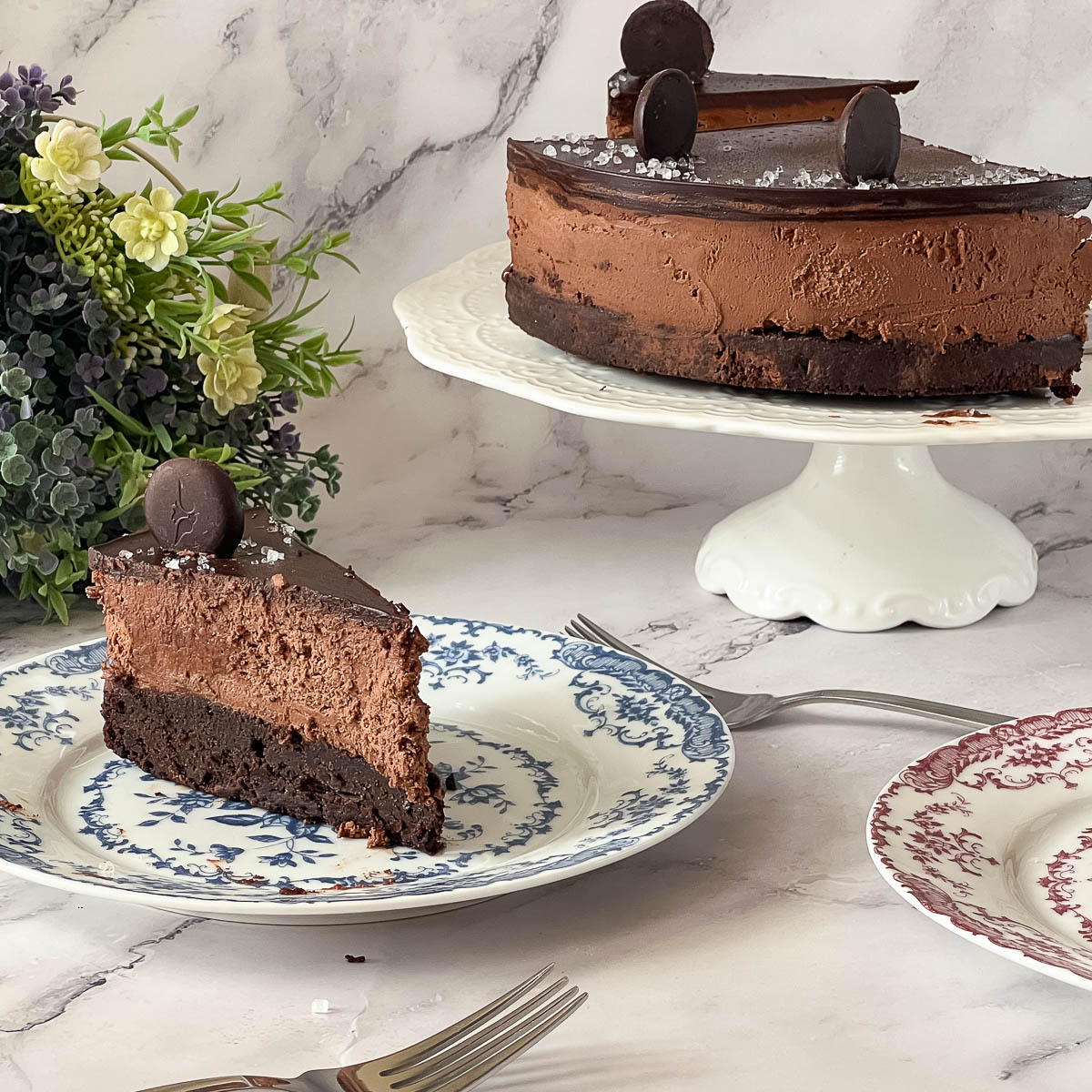Sliced mousse cake on the table.